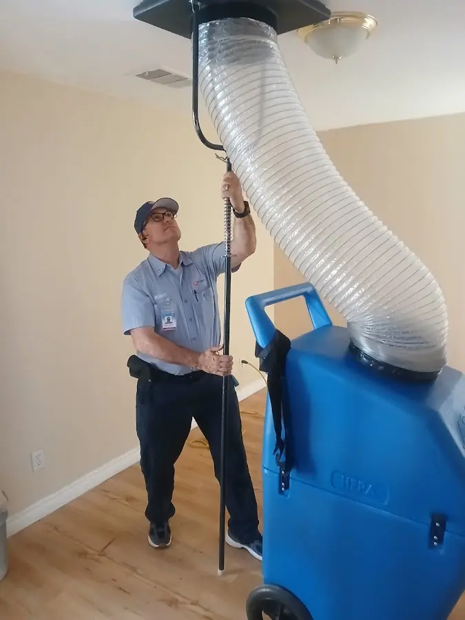 Furnace Tune-Up technician using HEPA equipment in Vernon Hills